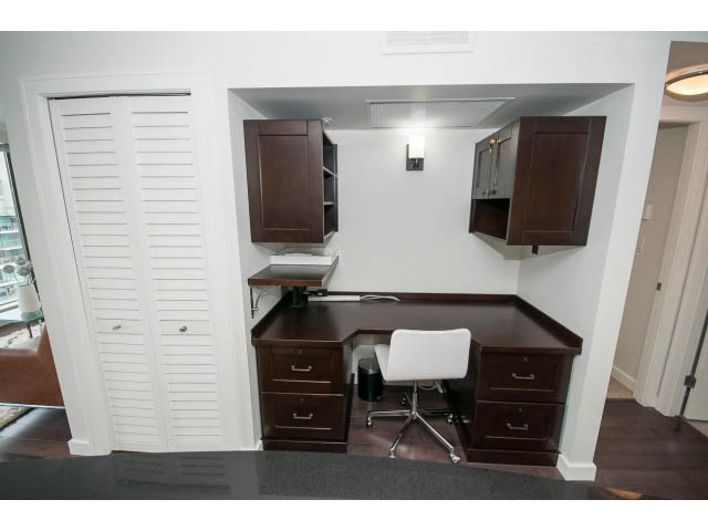Bright and modern office nook with dark wood cabinets, white walls, and a city view. - 2407 - 1723 Alberni, Vancouver Downtown