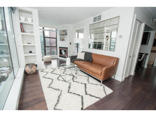 Bright living room with hardwood floors, city view, and modern furnishings. - 2407 - 1723 Alberni, Vancouver Downtown