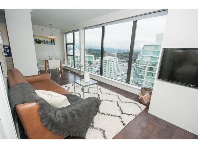 Bright living room with city view, hardwood floors, and modern furnishings. - 2407 - 1723 Alberni, Vancouver Downtown