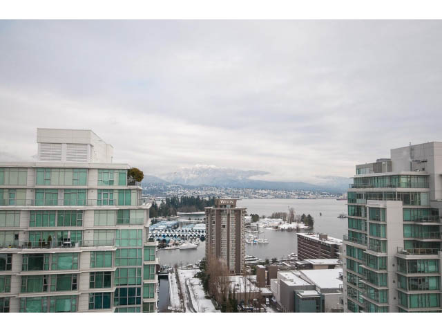 Furnished living room with city view and snow-covered mountains. - 2407 - 1723 Alberni, Vancouver Downtown
