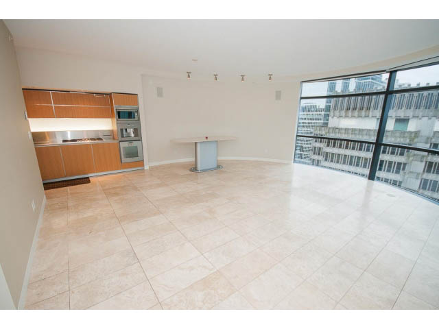 Bright open-concept living space with modern kitchen, hardwood floors, and city view. - 1902 - 838 W Hastings, Vancouver Downtown