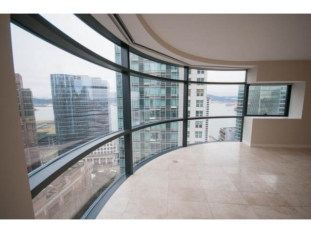 Spacious living room with floor-to-ceiling windows, city view, and modern decor. - 1902 - 838 W Hastings, Vancouver Downtown