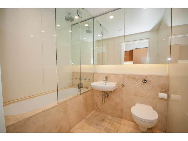 Spacious bathroom with marble countertops and a glass-enclosed shower. - 1902 - 838 W Hastings, Vancouver Downtown
