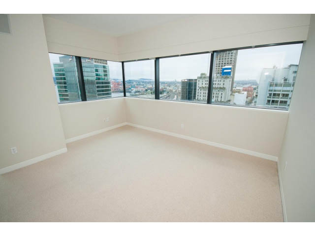 Spacious living room with large windows offering a city view. - 1902 - 838 W Hastings, Vancouver Downtown