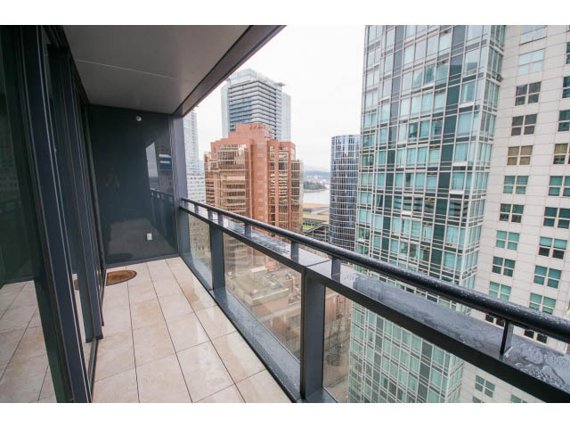 Furnished balcony with city view and modern glass railing. - 1902 - 838 W Hastings, Vancouver Downtown