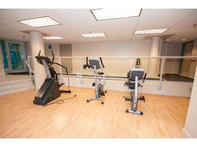 Bright gym with hardwood floors and cardio equipment. - 2005 - 1067 Marinaside Crescen, Vancouver Downtown