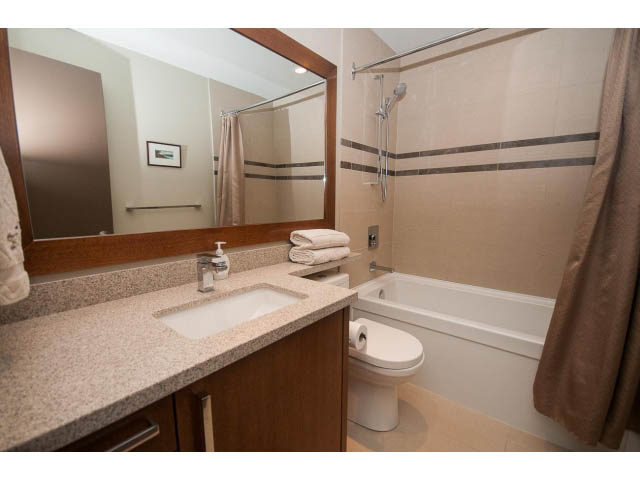 Spacious bathroom with granite countertops and a walk-in shower. - 5070 Marine Drive, West Vancouver
