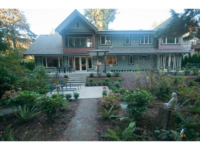 Furnished 4-bedroom house with a charming front garden and a cozy porch. - 5070 Marine Drive, West Vancouver