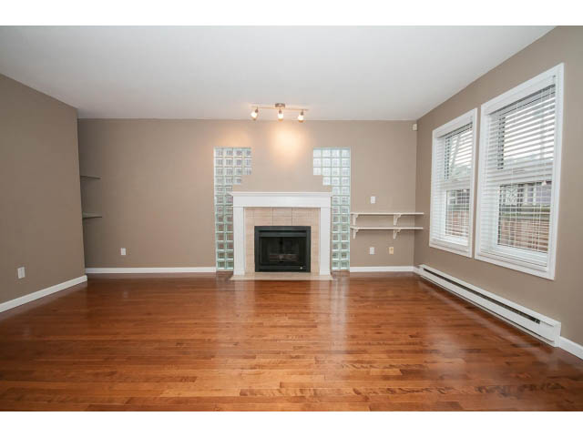 Open living space with hardwood floors and glass block fireplace. - 1962 West 11th Ave, Vancouver West Side