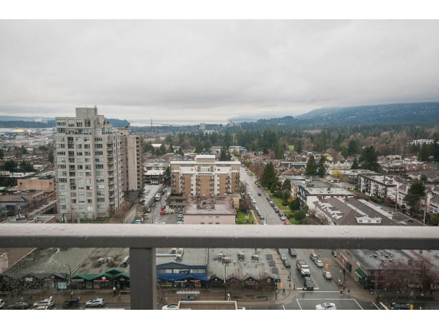 Bright living room with a stunning city view and modern furnishings. - 1702 - 135 East 17th Street, North Vancouver