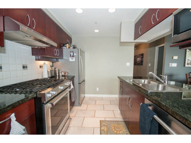 Bright kitchen with granite countertops, stainless steel appliances, and a city view. - 2706 -198 Aquarius Mews, Vancouver Downtown