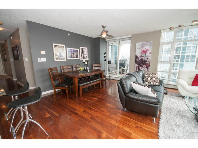 Furnished living room with hardwood floors, modern furniture, and city view. - 2706 -198 Aquarius Mews, Vancouver Downtown