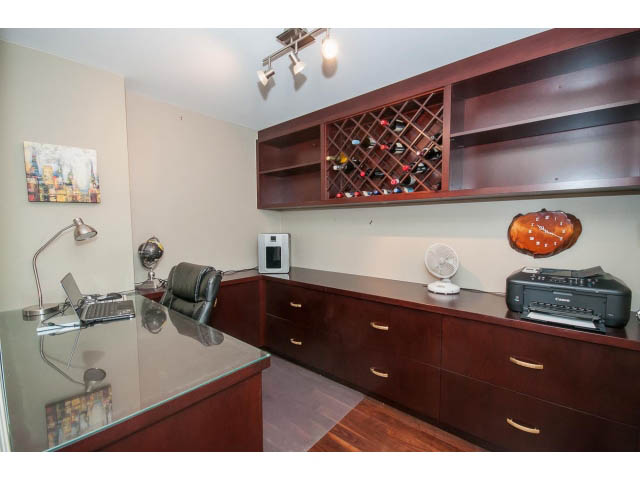 Furnished den with wine rack, hardwood floors, and city view. - 2706 -198 Aquarius Mews, Vancouver Downtown