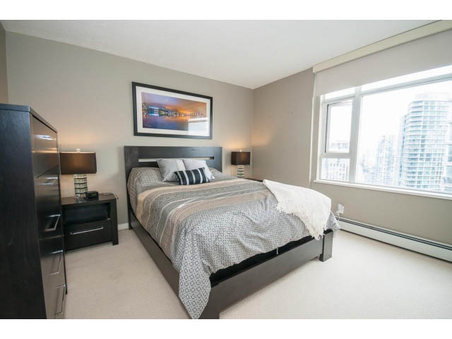 Spacious bedroom with city view and modern furnishings. - 2706 -198 Aquarius Mews, Vancouver Downtown