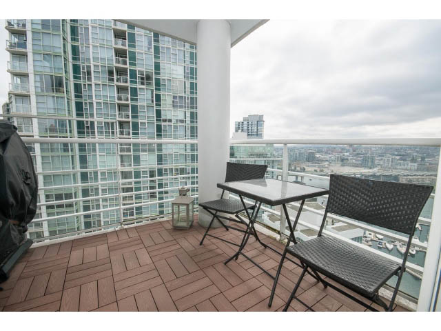 Furnished balcony with outdoor seating and city view. - 2706 -198 Aquarius Mews, Vancouver Downtown