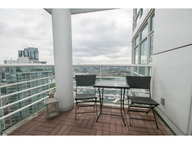 Furnished balcony with outdoor seating and city view. - 2706 -198 Aquarius Mews, Vancouver Downtown