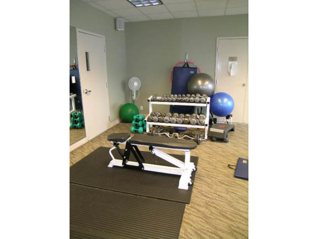 Fitness room with exercise equipment, mats, and weights. - 2706 -198 Aquarius Mews, Vancouver Downtown