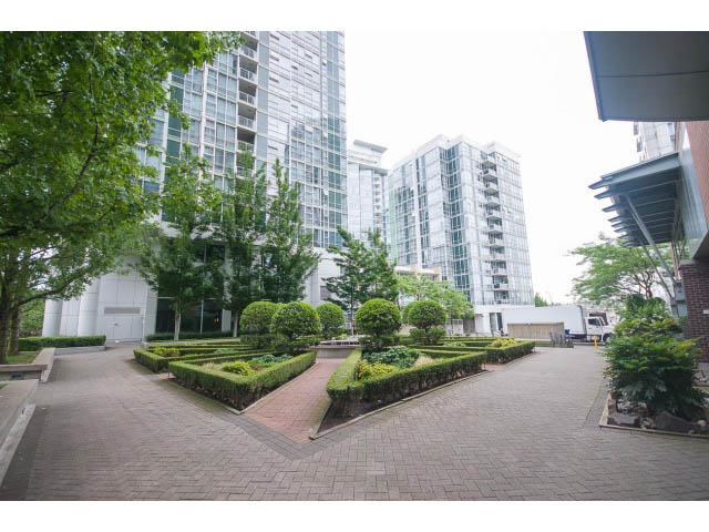 Furnished living room with modern furnishings and city view. - 2706 -198 Aquarius Mews, Vancouver Downtown