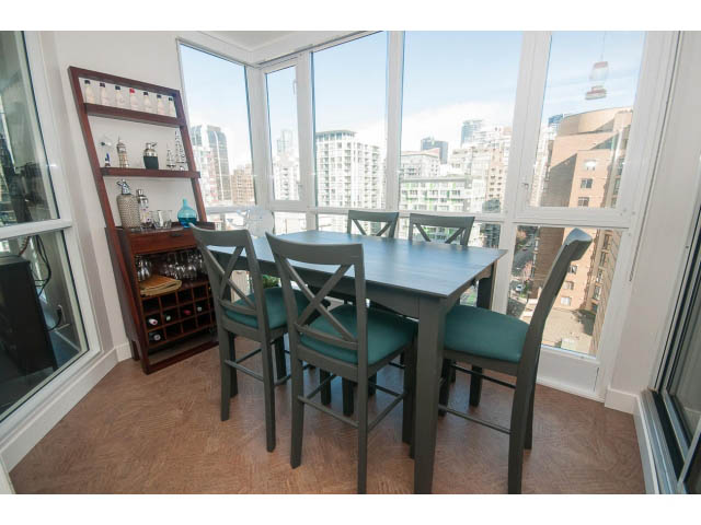Bright dining area with city view, hardwood floors, and modern decor. - 1203 - 1188 Richards, Vancouver Downtown