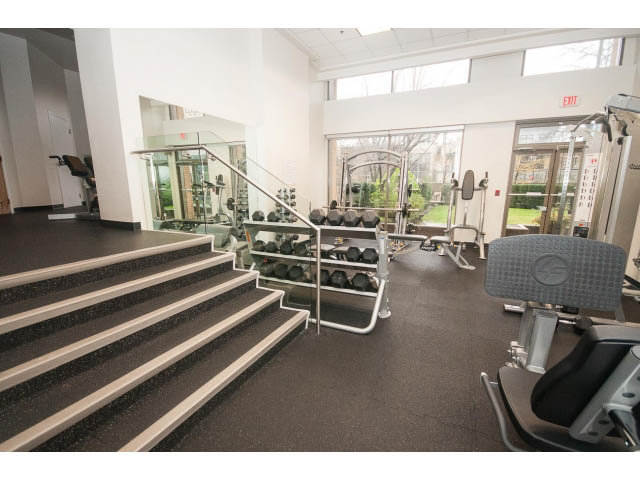 Bright and spacious gym with cardio machines, free weights, and a view of the city. - 1203 - 1188 Richards, Vancouver Downtown