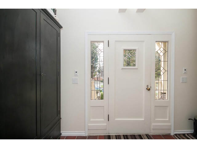 Bright entryway with white double doors and decorative glass panels. - 3 - 2535 West 6th Ave, Vancouver West Side