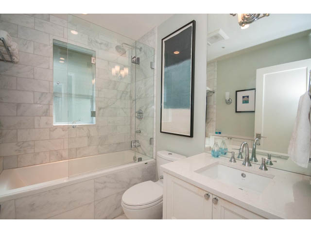 Furnished bathroom with marble countertops and a walk-in shower. - 3 - 2535 West 6th Ave, Vancouver West Side