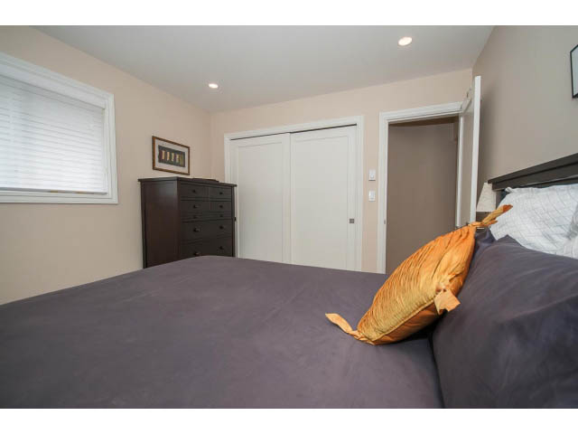 Furnished bedroom with a bed, closet, and dresser. - 3 - 2535 West 6th Ave, Vancouver West Side