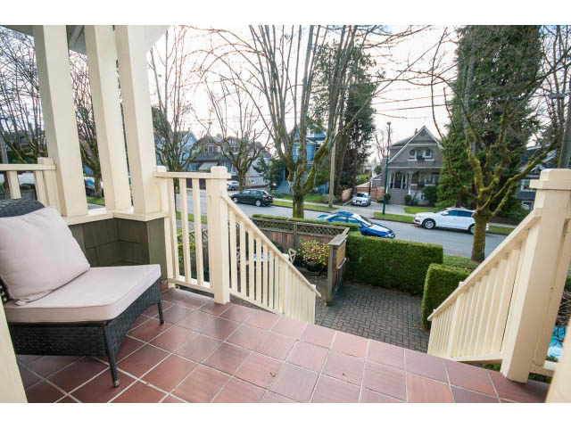 Furnished patio with outdoor seating and view of street and houses. - 3 - 2535 West 6th Ave, Vancouver West Side