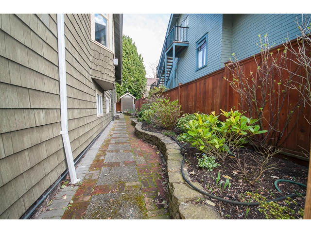 Furnished patio with brick pathway and greenery. - 3 - 2535 West 6th Ave, Vancouver West Side