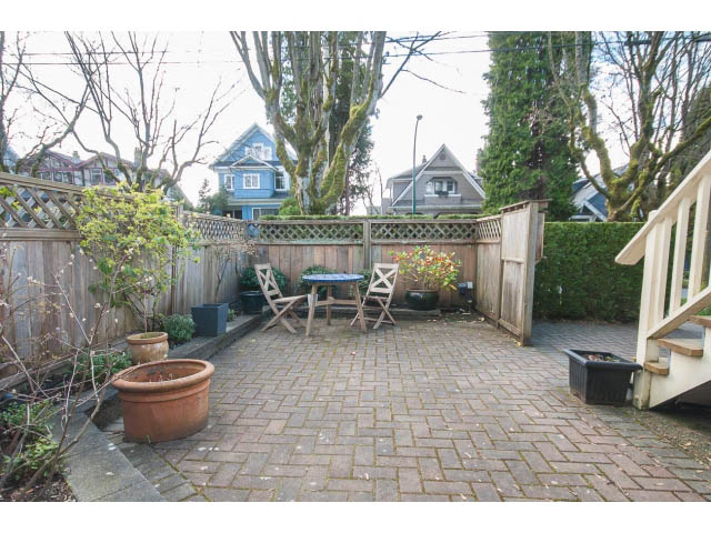 Furnished patio with brick pavers, wooden railings, and potted plants. - 3 - 2535 West 6th Ave, Vancouver West Side