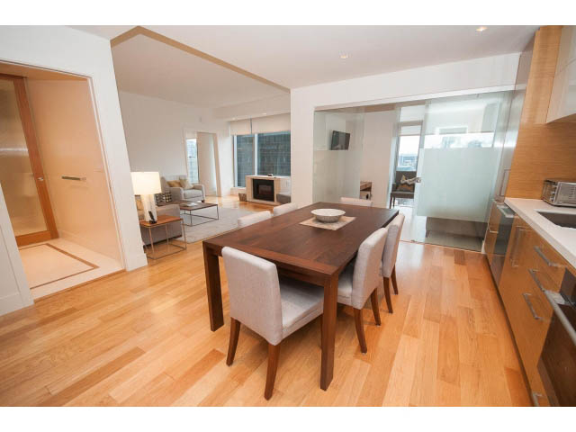 Furnished dining area with hardwood floors and city view. - 1701 - 667 Howe Street, Vancouver Downtown