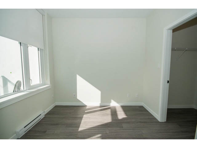 Bright living room with hardwood floors and large windows. - 317 - 311 East 6th Avenue, Vancouver East Side