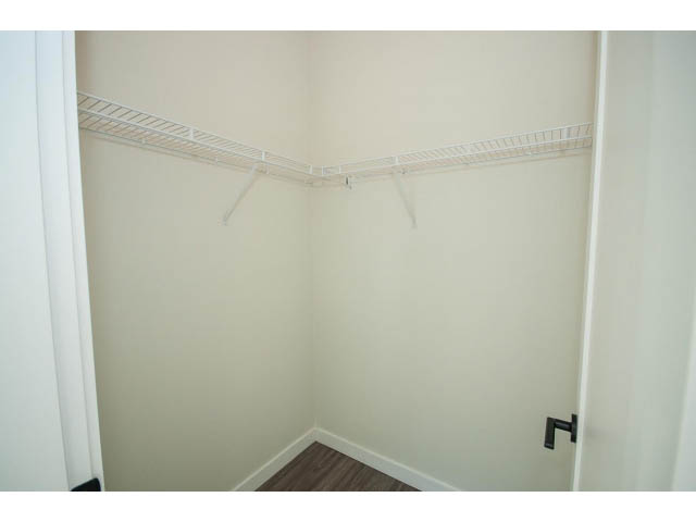 Bright walk-in closet with white shelving and wooden flooring. - 317 - 311 East 6th Avenue, Vancouver East Side