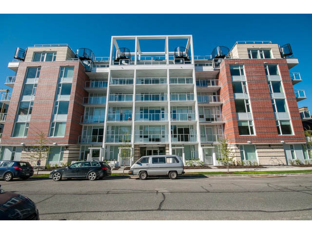 Bright 1-bedroom condo with modern balcony and brick facade. - 317 - 311 East 6th Avenue, Vancouver East Side