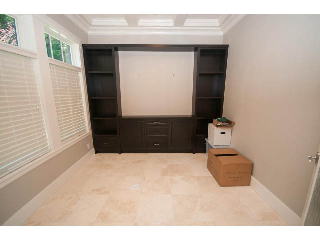 Den with built-in shelving and tiled floor. - 3921 West 10th, Vancouver West Side