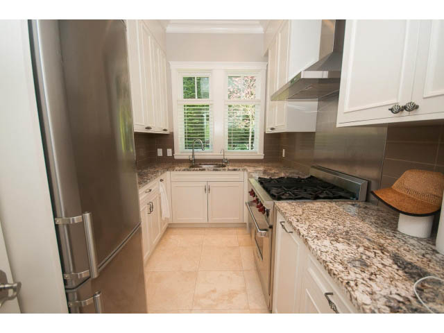 Bright kitchen with granite countertops and stainless steel appliances. - 3921 West 10th, Vancouver West Side
