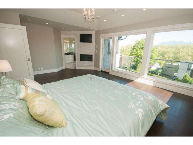 Bright bedroom with hardwood floors, large windows, and a city view. - 3921 West 10th, Vancouver West Side
