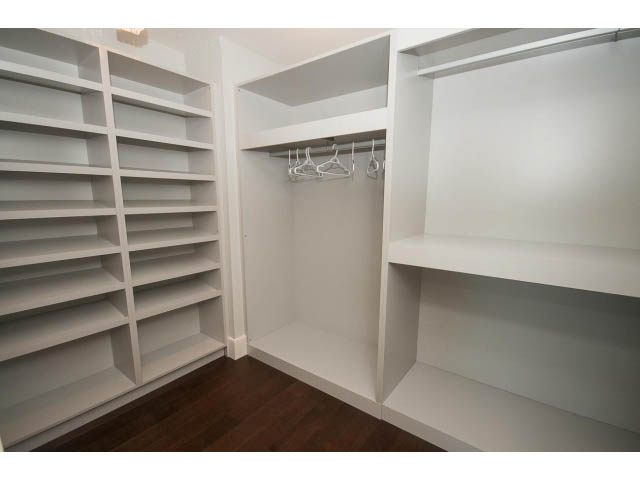 Spacious walk-in closet with built-in shelves and hanging rods. - 3921 West 10th, Vancouver West Side