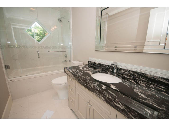 Spacious bathroom with marble countertops and a walk-in shower. - 3921 West 10th, Vancouver West Side