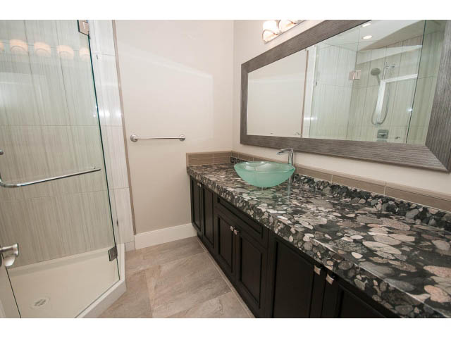 Furnished bathroom with marble countertops and a walk-in shower. - 3921 West 10th, Vancouver West Side