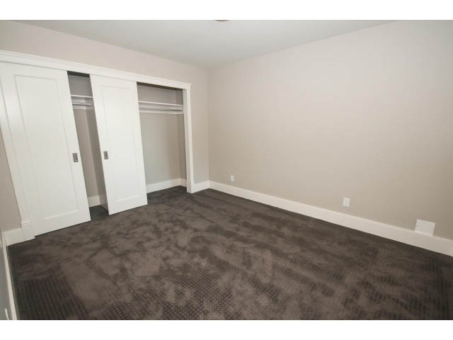 Spacious bedroom with built-in closet and carpeted floor. - 3921 West 10th, Vancouver West Side