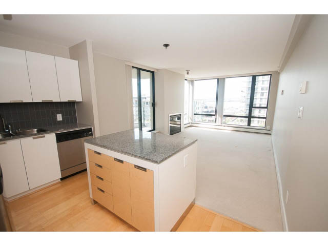 Bright kitchen with granite countertops, hardwood floors, and a city view. - 701 - 151 West 2nd Street, North Vancouver