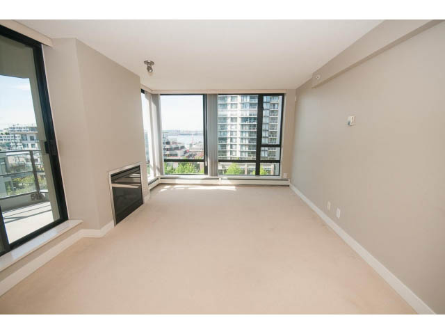 Spacious living room with hardwood floors and city view. - 701 - 151 West 2nd Street, North Vancouver