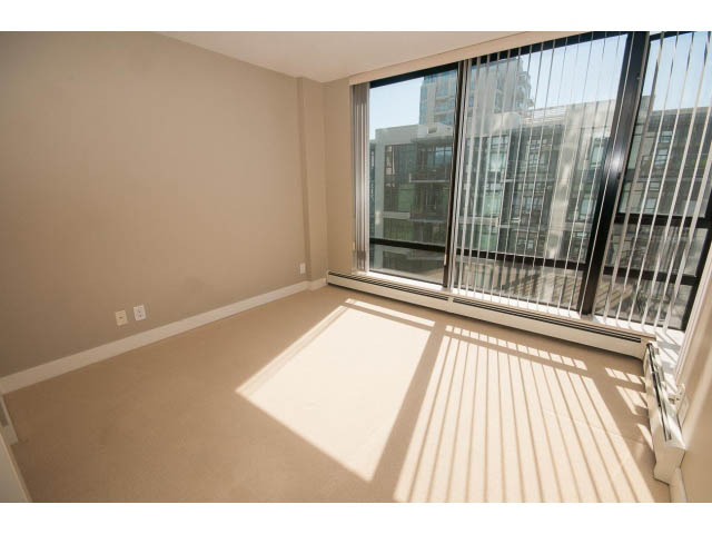 Bright living room with large windows and city view. - 701 - 151 West 2nd Street, North Vancouver