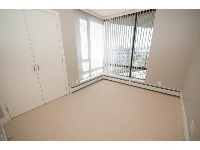 Bright bedroom with large windows and city view. - 701 - 151 West 2nd Street, North Vancouver