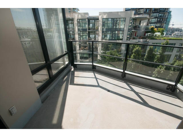 Bright balcony with expansive city view and modern railings. - 701 - 151 West 2nd Street, North Vancouver
