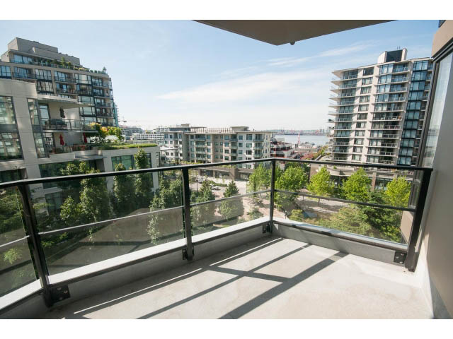 Bright balcony with city view and modern railings. - 701 - 151 West 2nd Street, North Vancouver