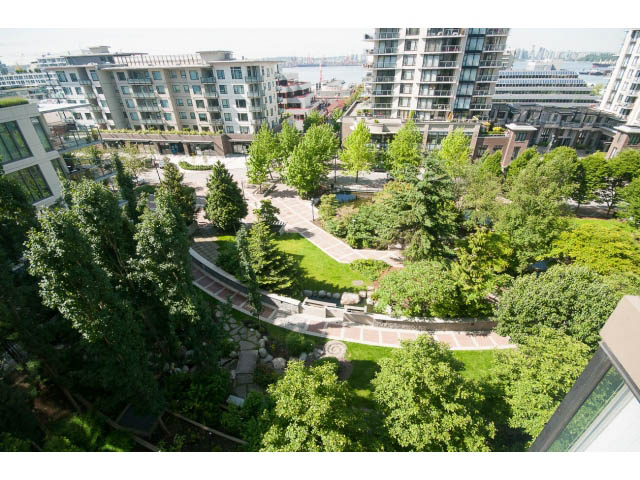 Furnished living room with city view and greenery. - 701 - 151 West 2nd Street, North Vancouver