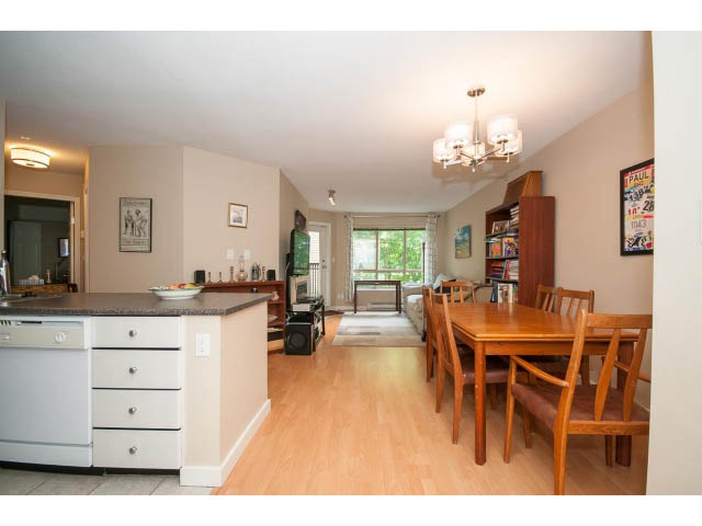 Furnished 2-bedroom condo with hardwood floors and a modern kitchen featuring granite countertops. - 201 - 150 West 22nd Street, North Vancouver