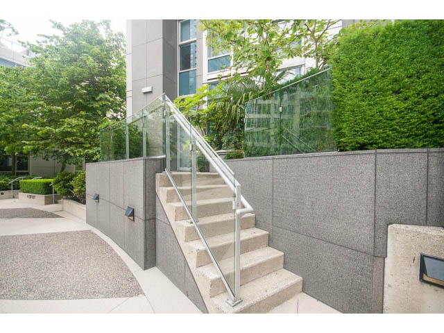 Staircase with glass railings leading to a modern townhouse entryway. - TH17 - 1233 West Cordova St, Vancouver Downtown